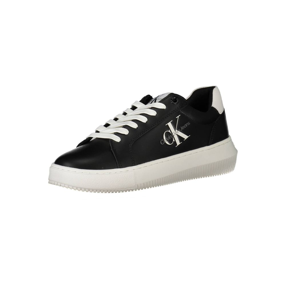 Calvin Klein black leather low-top sneaker with white laces, white platform sole, and white CK logo on the side.