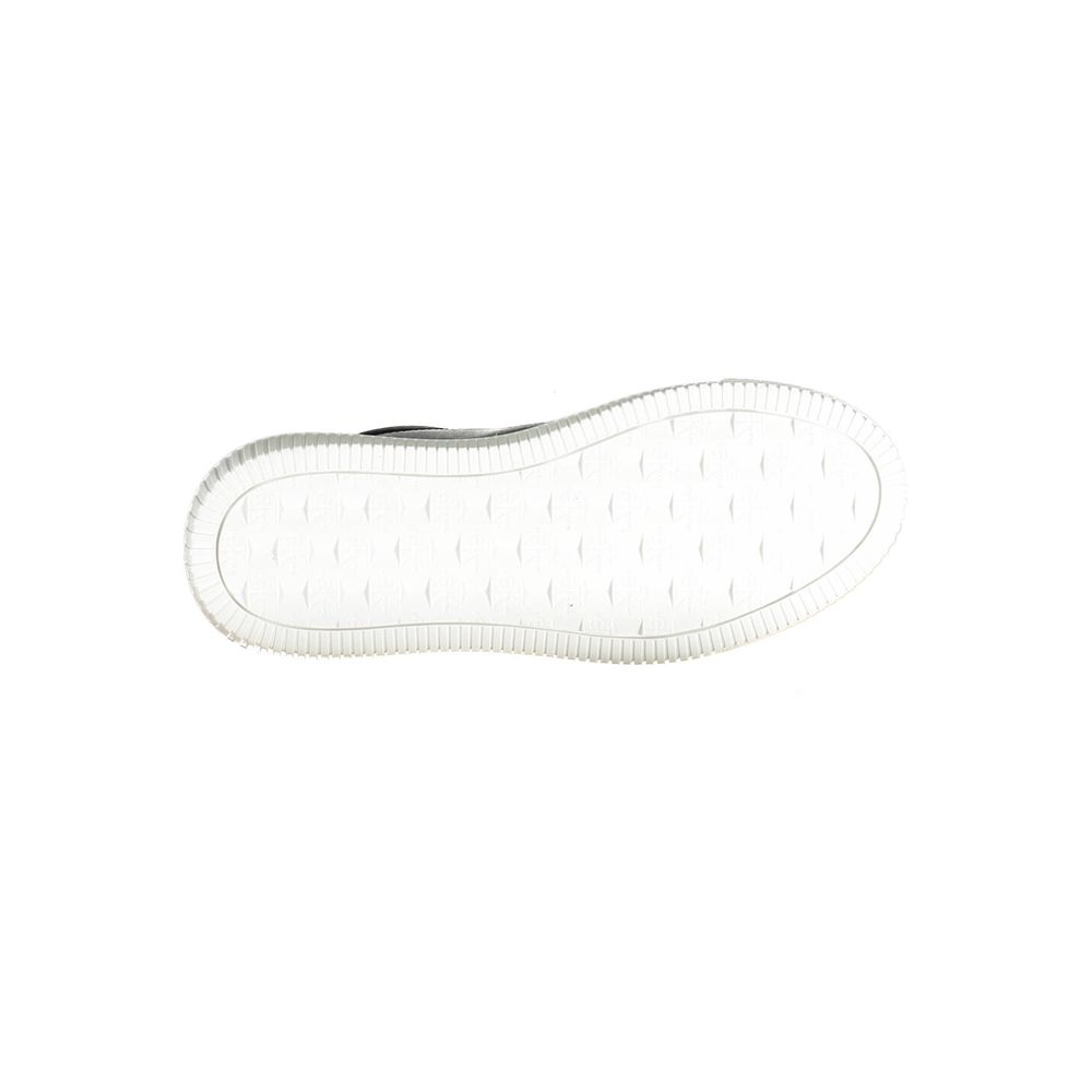 Underside of a black leather Calvin Klein women’s sneaker with a textured white rubber sole.