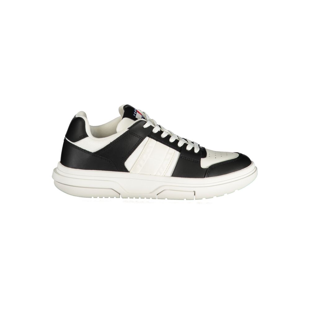 Tommy Hilfiger black and white leather sneaker with a chunky white rubber sole and lace-up front.
