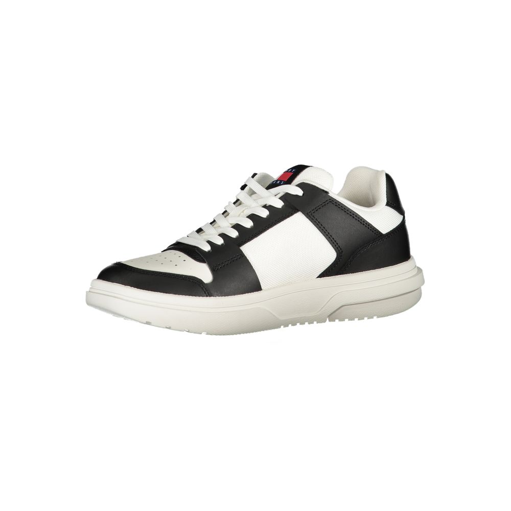 Tommy Hilfiger black and white leather low-top lace-up sneaker with a thick, textured white rubber sole.