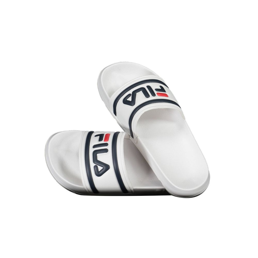 White Fila polyurethane slide sandals for women with navy and red logo detailing.