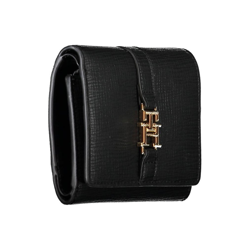 Black textured polyurethane foldover women's wallet with a gold logo clasp