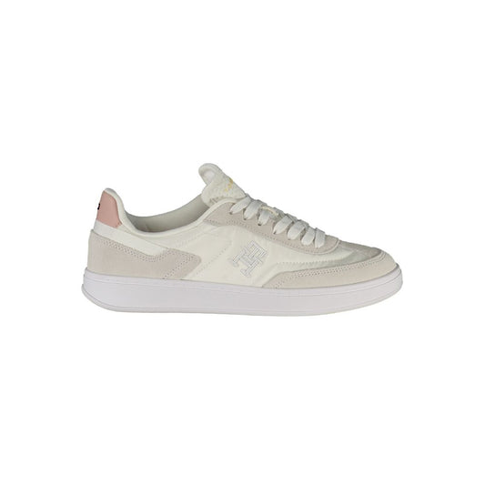 White Tommy Hilfiger women’s polyurethane sneakers with suede accents and a subtle logo side detail.