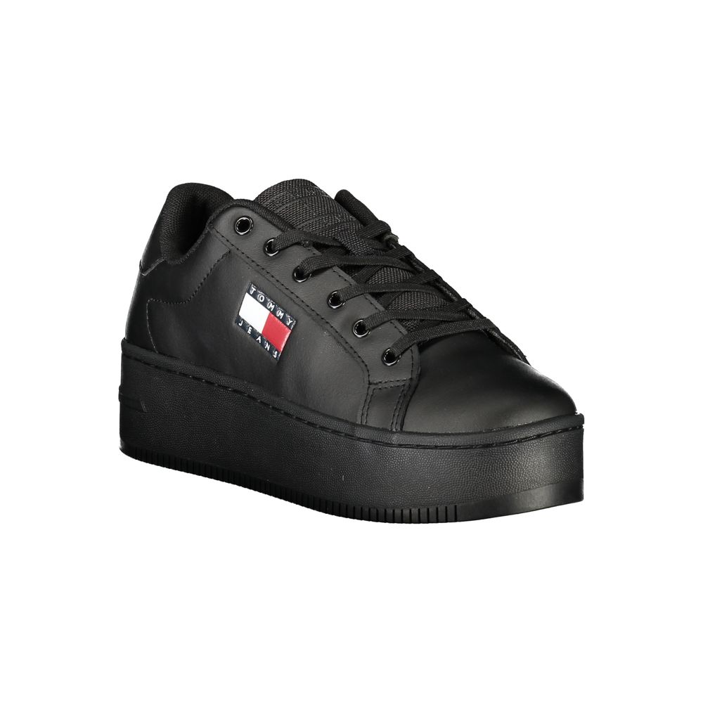 Black sneaker with a brand logo on a white background