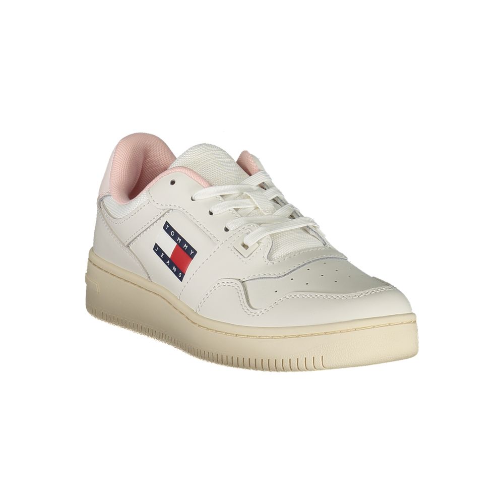 Tommy Hilfiger white leather women’s sneaker with pink trim and side logo, set on a cream rubber cupsole.