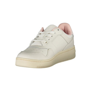 White leather Tommy Hilfiger women’s sneaker with pale pink lining and a cream-colored rubber sole.