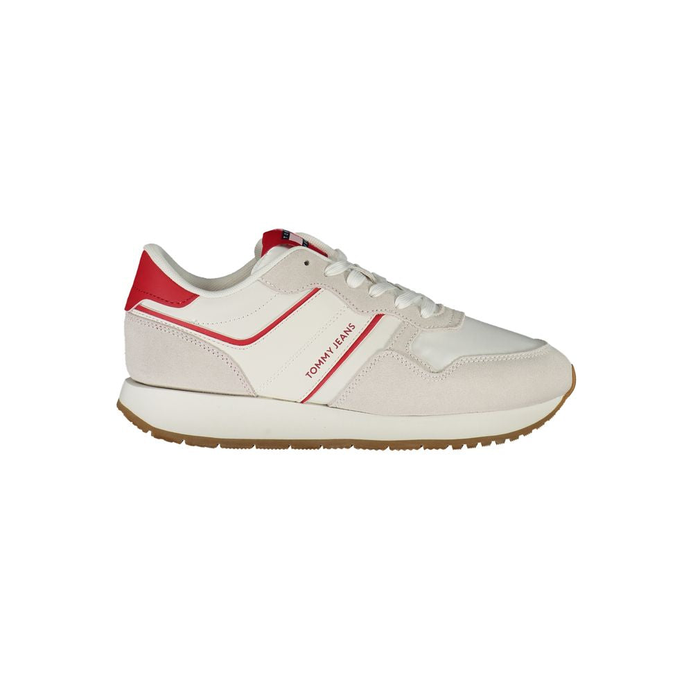 Tommy Hilfiger women’s sneaker in cream polyurethane and suede with red accents, lace-up style, and brown rubber sole.