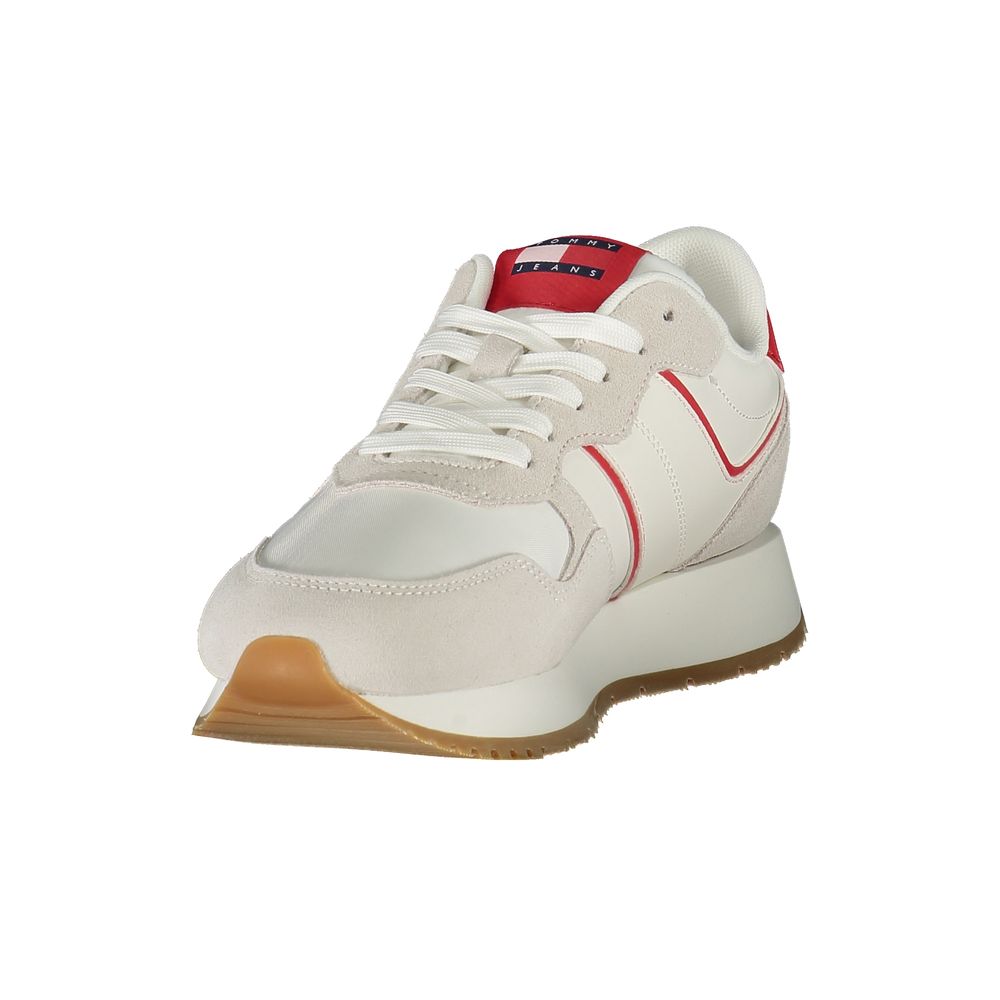 White Tommy Hilfiger polyurethane sneakers with suede overlays, red accents, lace-up style, and a chunky gum sole.