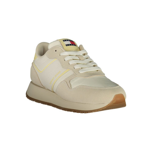 Tommy Hilfiger beige polyurethane women's sneaker with a classic low-top athletic style and white laces.