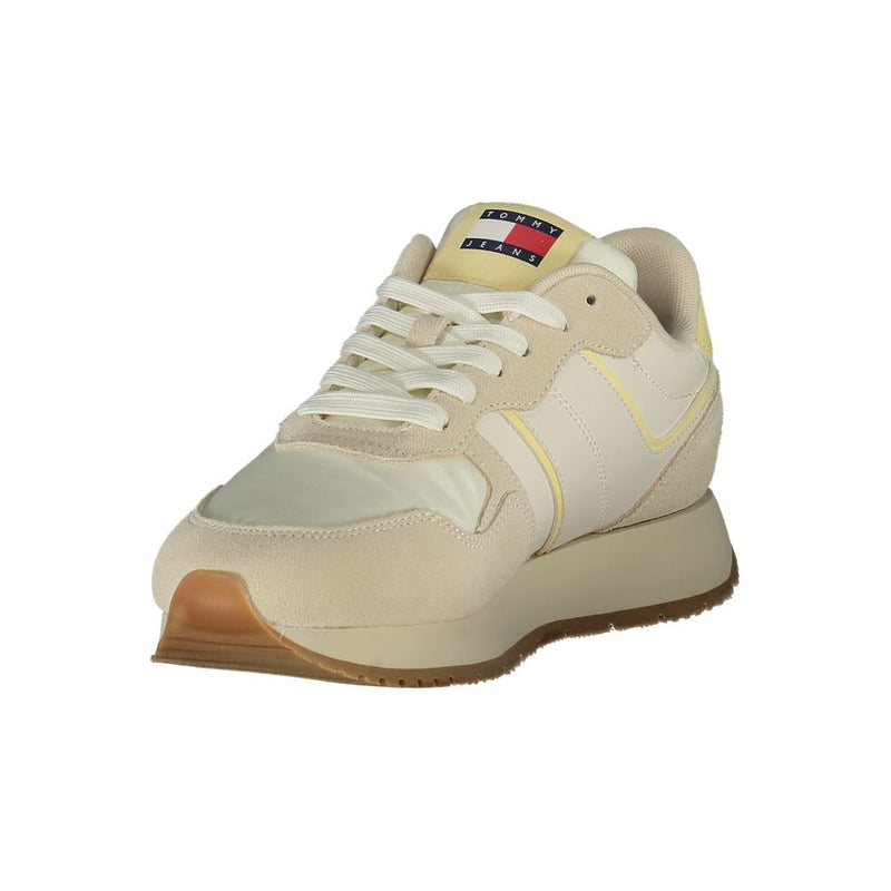 Tommy Hilfiger beige polyurethane women's sneaker with suede overlays and gum rubber sole.