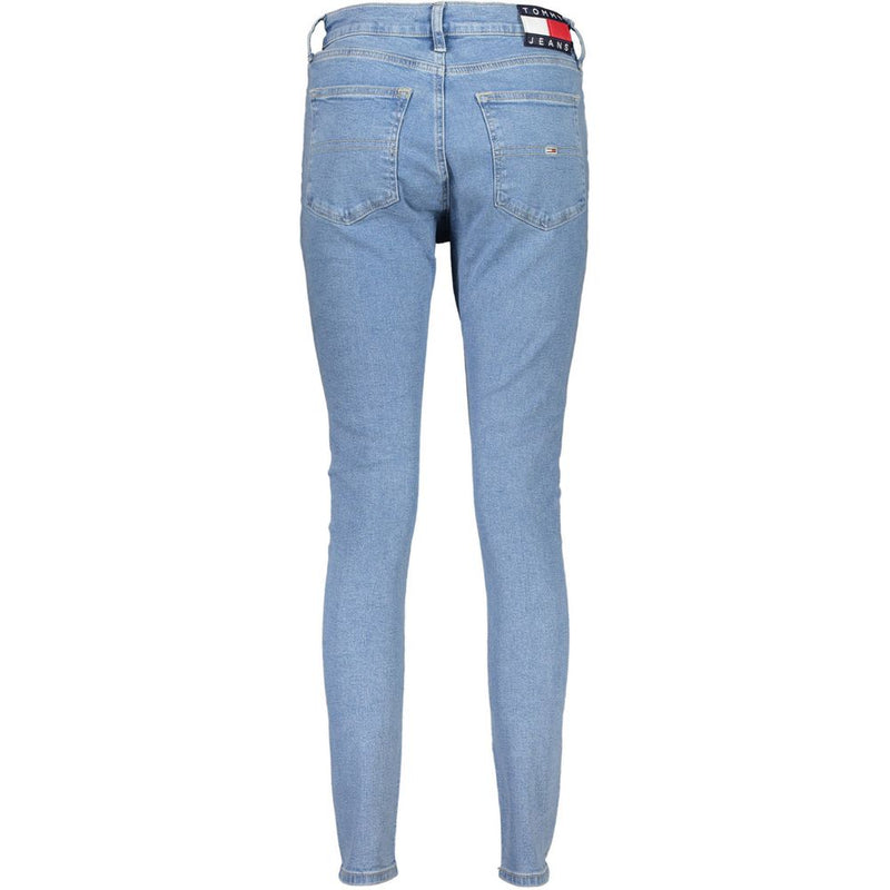 Light blue cotton skinny women jeans from behind with back pockets and a logo patch