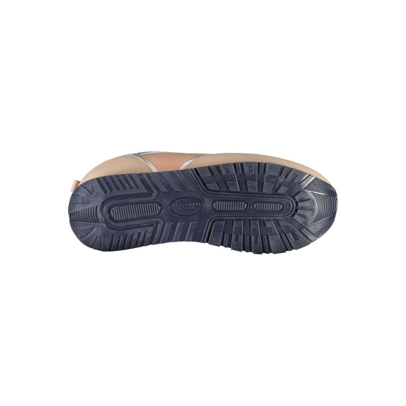 U.S. POLO ASSN. women's sneaker in pink polyurethane with a navy blue lugged rubber sole, viewed from below.
