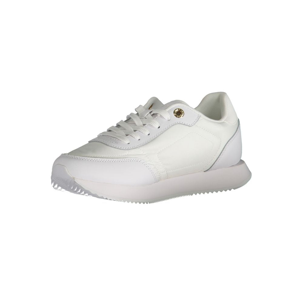 Tommy Hilfiger white leather women's low-top sneaker with a chunky white sole and gold-tone eyelet detail.