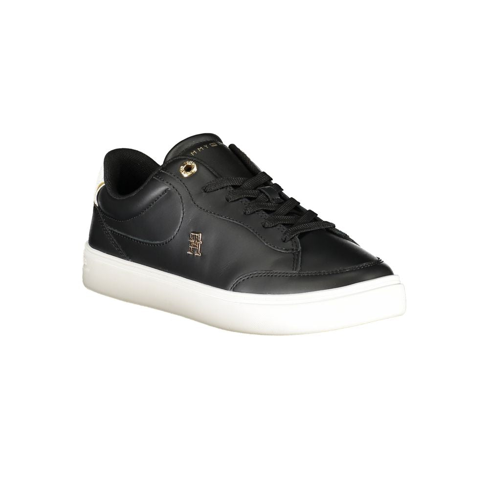 Black sneaker with white sole on a white background