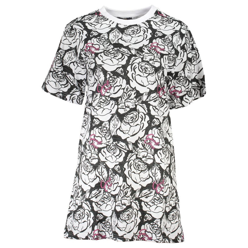 White cotton t-shirt dress with black floral print and pink accents