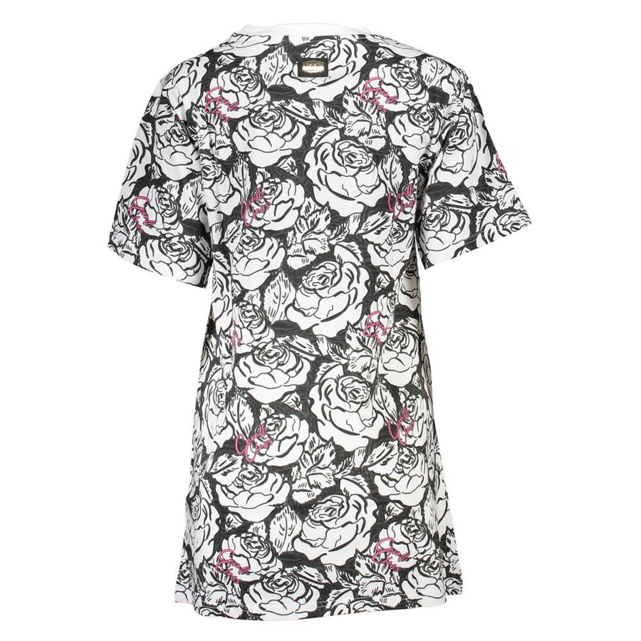 White cotton t-shirt dress with black floral print and pink accents