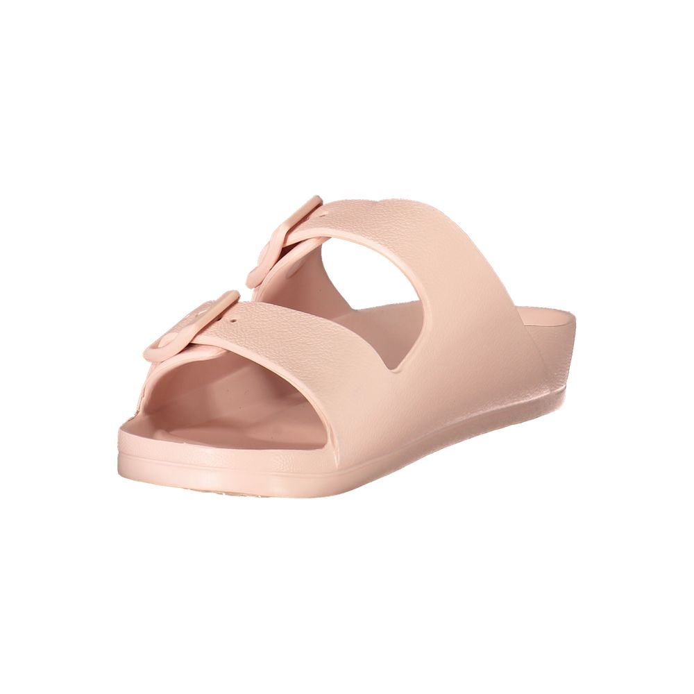 Women’s blush pink plastic ciabatta sandals with double buckle straps in a minimalist slip-on style.