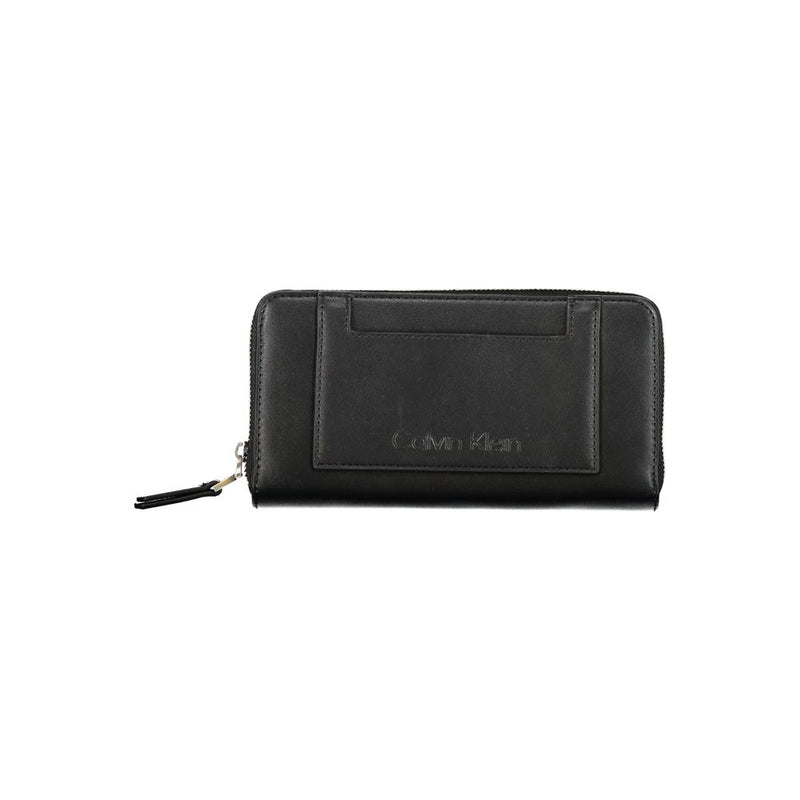 Black polyester zip-around women's wallet with an exterior slip pocket and debossed Calvin Klein logo