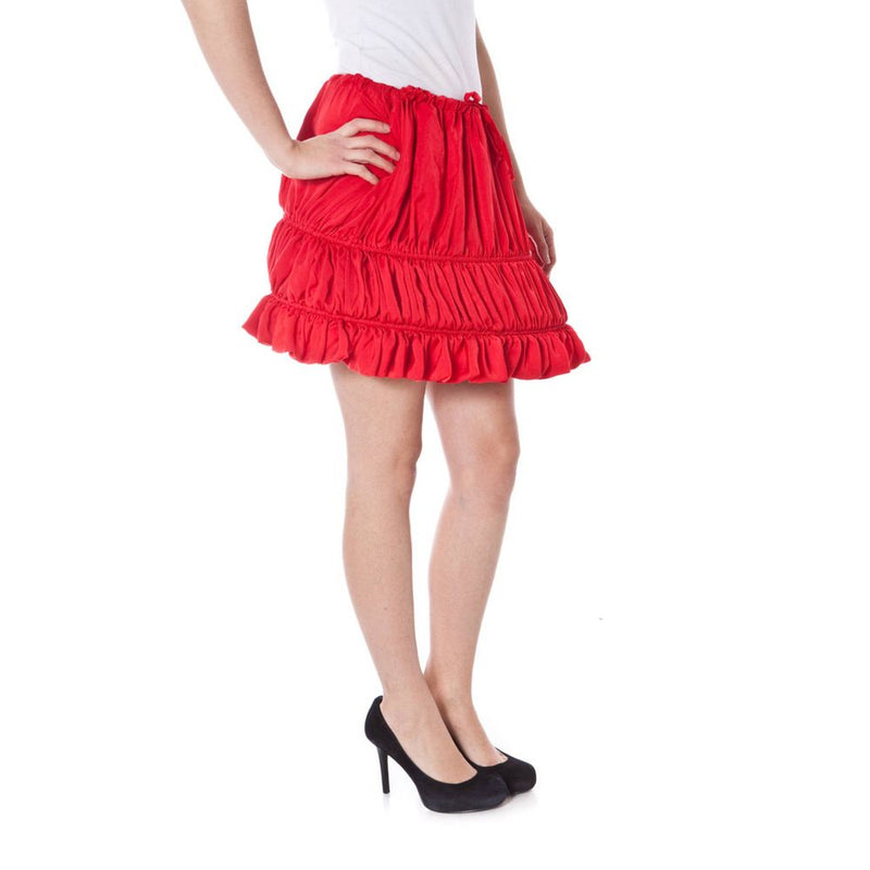 Red polyester tiered miniskirt with ruffled hem worn by a woman
