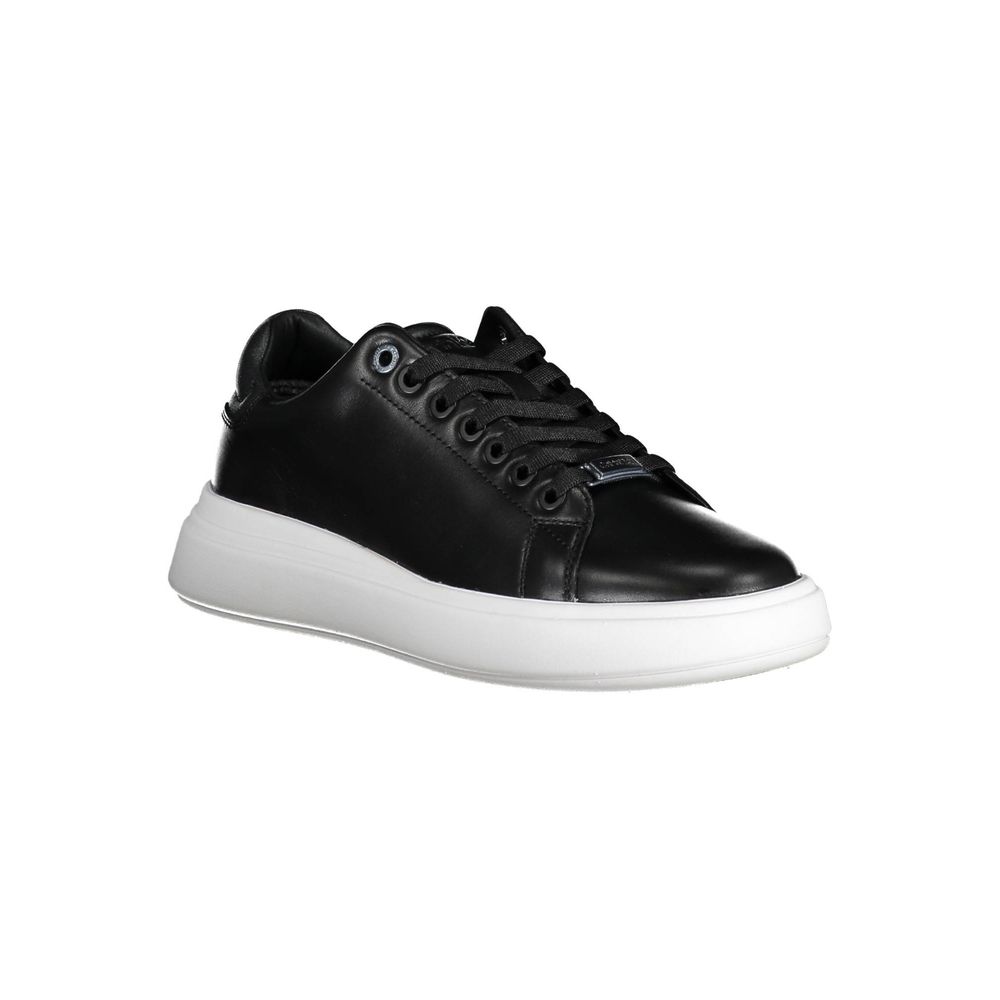 Calvin Klein black leather women's sneaker with lace-up front, metallic branding, and a thick white platform sole.