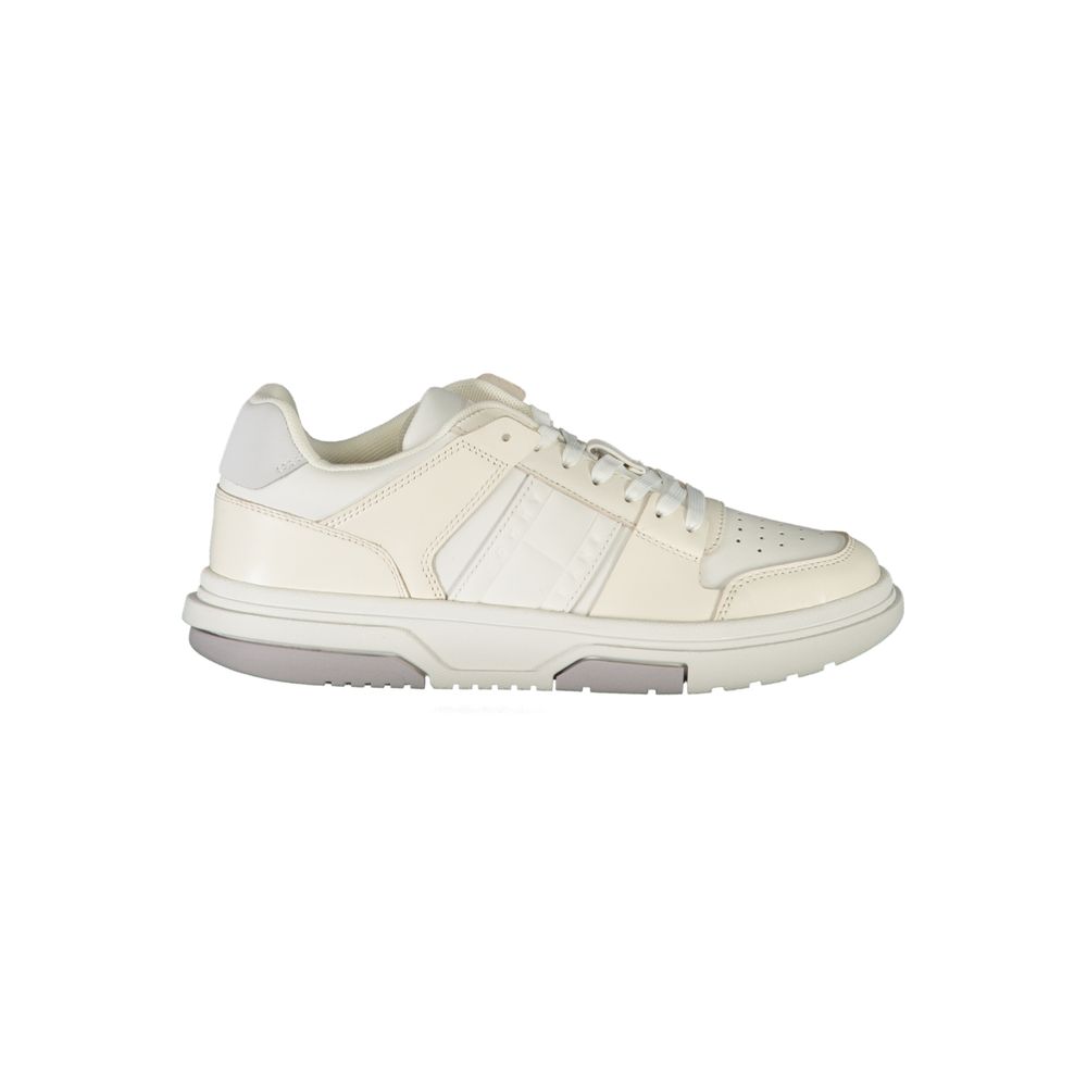 Tommy Hilfiger white leather women’s sneaker with a classic lace-up style and a flat, chunky rubber sole.