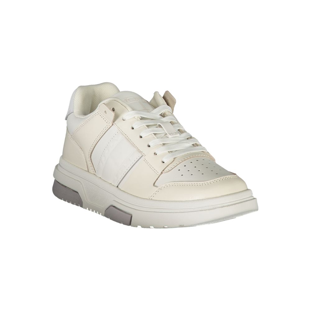 Tommy Hilfiger women's white leather low-top sneaker with a chunky sole and lace-up design.