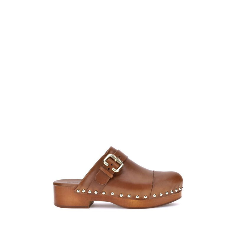 Brown clog shoe with a buckle and studs on a white background