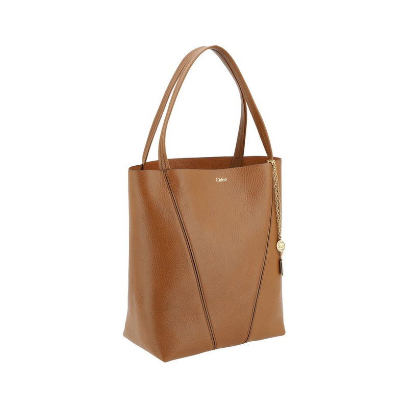 Brown leather Chloé shoulder bag with double straps and a hanging gold chain charm
