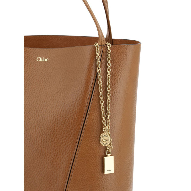 Brown leather Chloé shoulder bag with gold chain charm and embossed logo