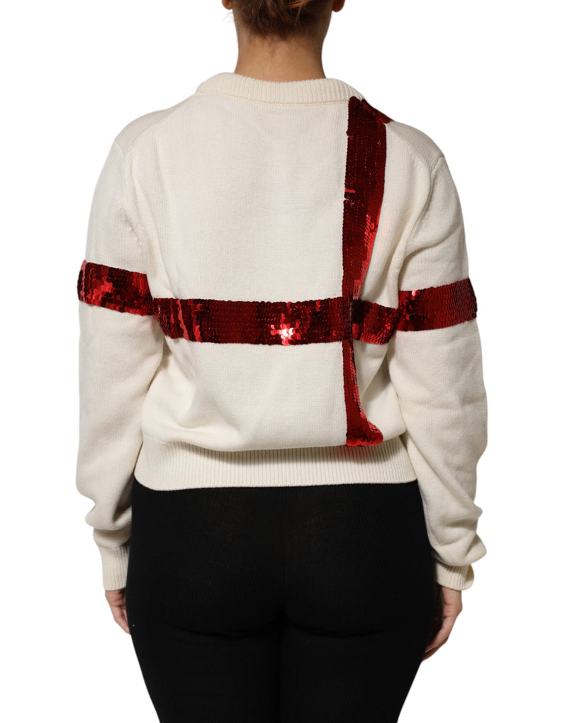 White knit crew neck sweater with red sequin cross pattern on back