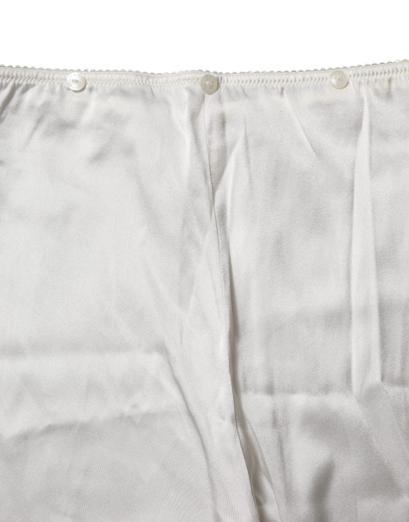 Ivory silk high waist pants with button closure and scalloped trim