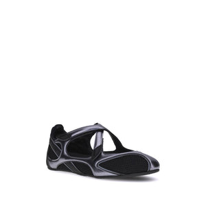 Metallic silver and black mesh women’s athletic ballet flat with crossover straps and a low-profile sole.