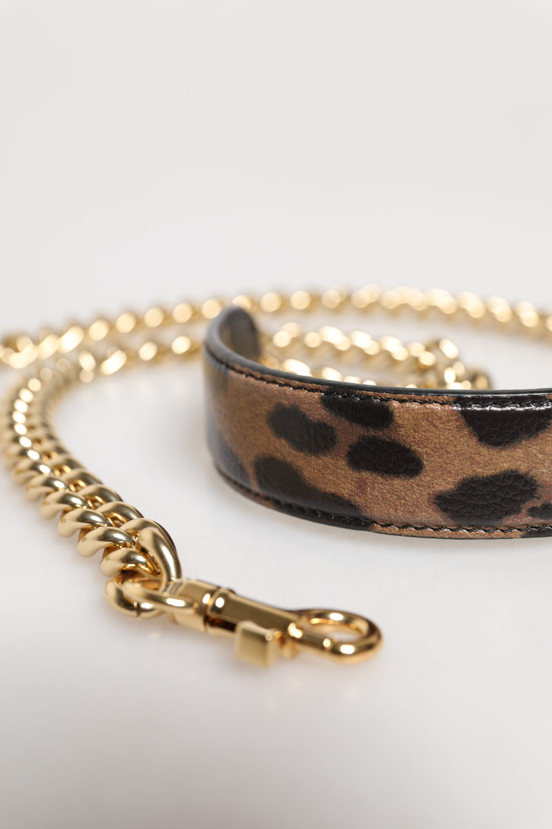 Brown leopard print leather shoulder strap with a gold brass chain and clasp