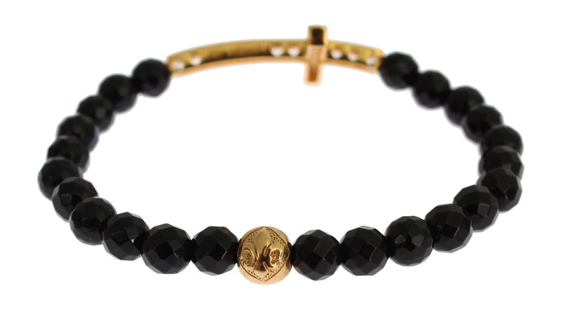 Black beaded gemstone bracelet featuring a gold cross charm and silver accents