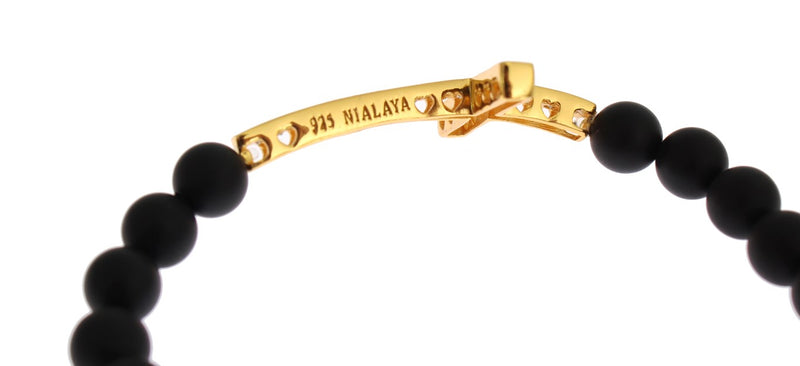 Black matte onyx bead bracelet with a gold-plated silver cross charm engraved with 925 and Nialaya