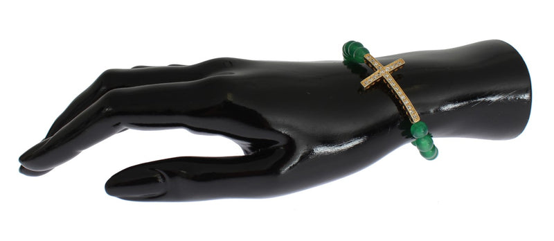 Green jade bead bracelet featuring a gold CZ cross on a black mannequin hand