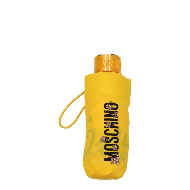 Bright yellow folded polyester umbrella with black Moschino bear branding and a matching case