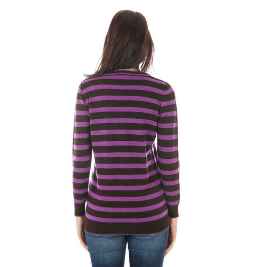 Woman wearing a purple and brown striped cashmere sweater from behind