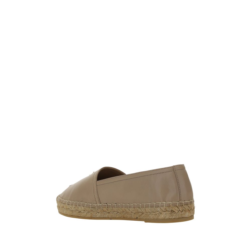Beige lamb leather espadrilles with a traditional braided jute midsole and a flat rubber sole.