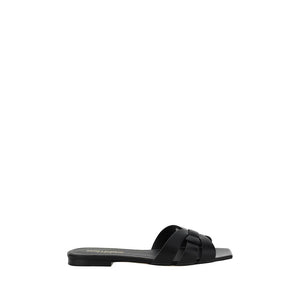 Black sandal with a bow on a white background