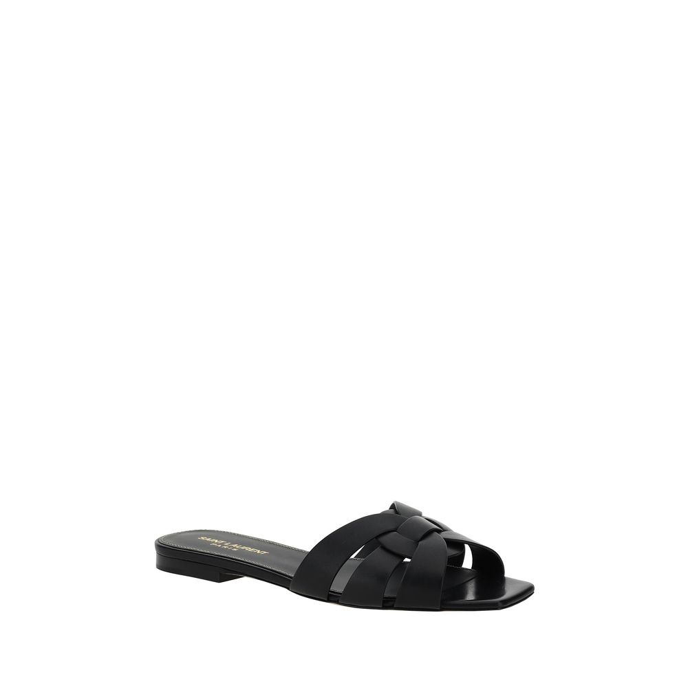 Black sandal with woven design on a white background