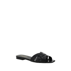 Black sandal with woven design on a white background