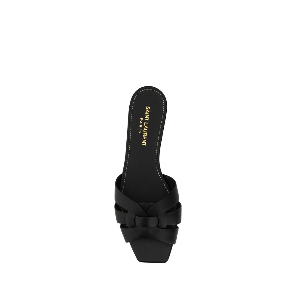 Black sandal with a bow detail on a white background