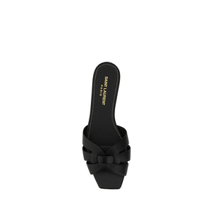 Black sandal with a bow detail on a white background