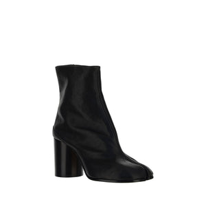 Black ankle boot with a block heel on a white background
