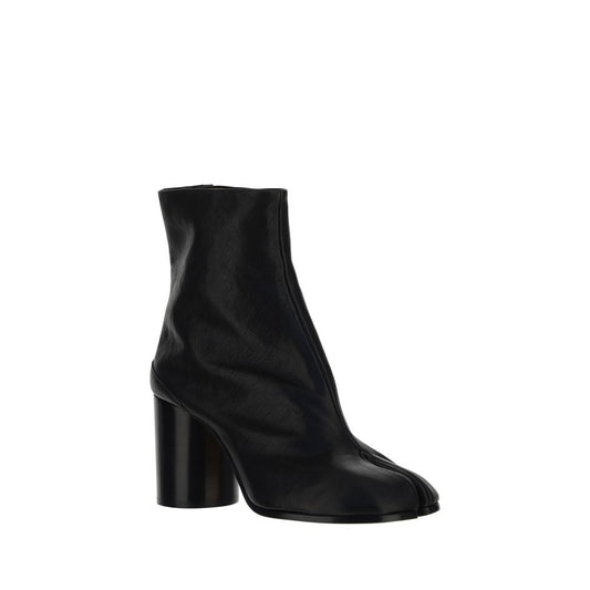 Black ankle boot with a block heel on a white background