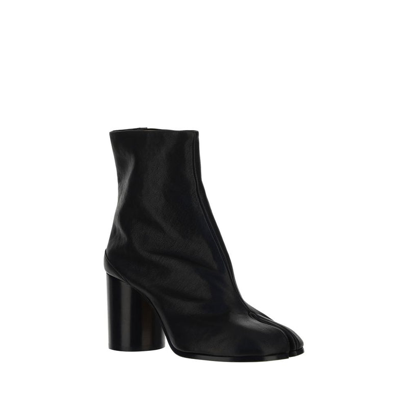 Black ankle boot with a block heel on a white background