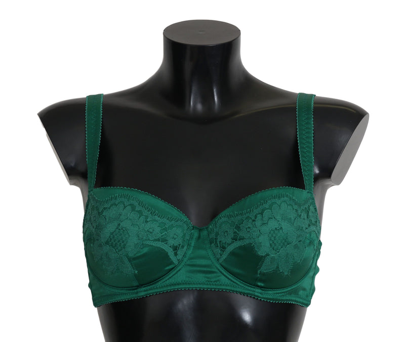 Dark green silk and floral lace bra on a black mannequin