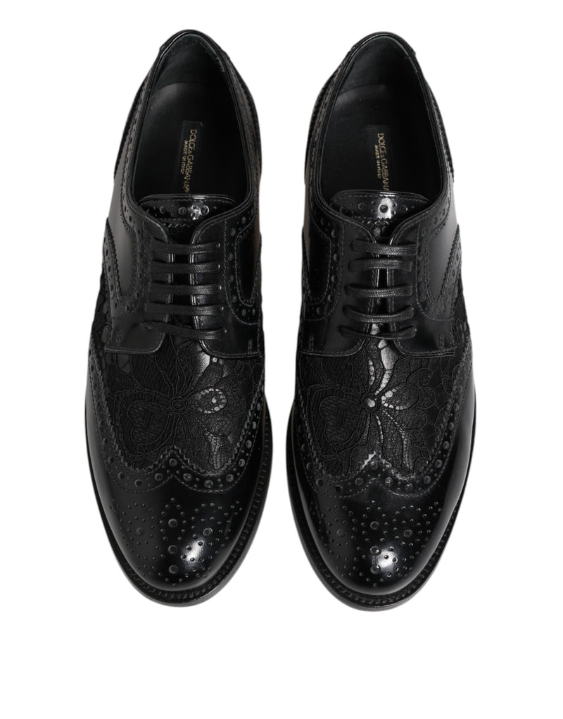 Dolce & Gabbana black leather lace-up formal brogues featuring intricate floral lace panels and perforated detailing.