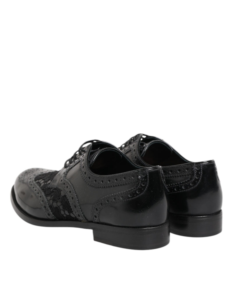 Black leather and lace brogue formal shoes by Dolce & Gabbana with wingtip detailing and a low block heel.